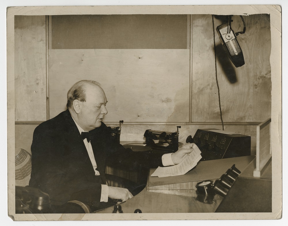 Photograph of Winston Churchill broadcasting a speech, 1939.
